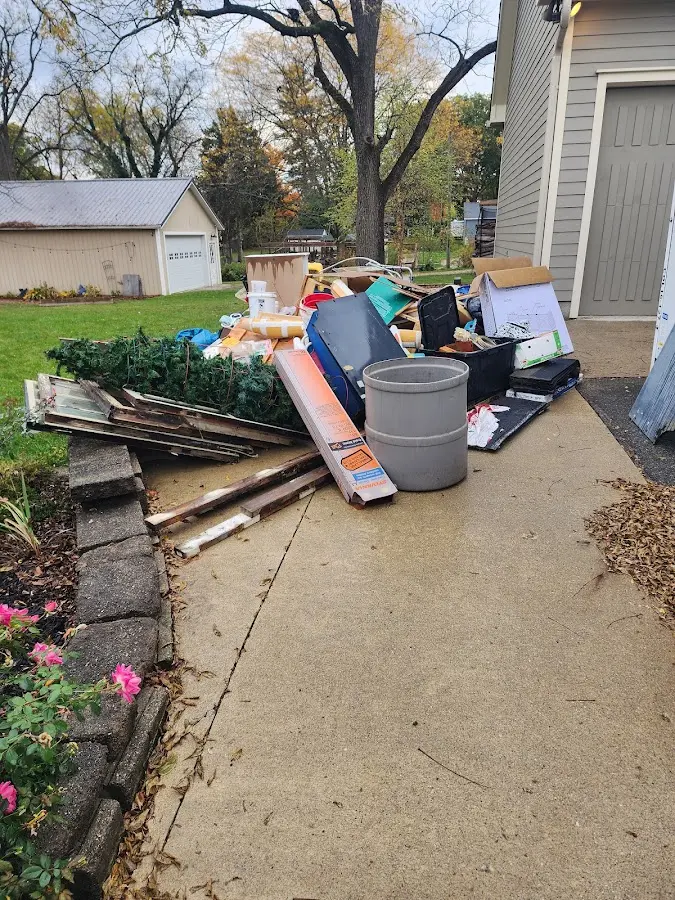 Dumpster being loaded with debris for Demolition Dumpster Rental in Scarsdale